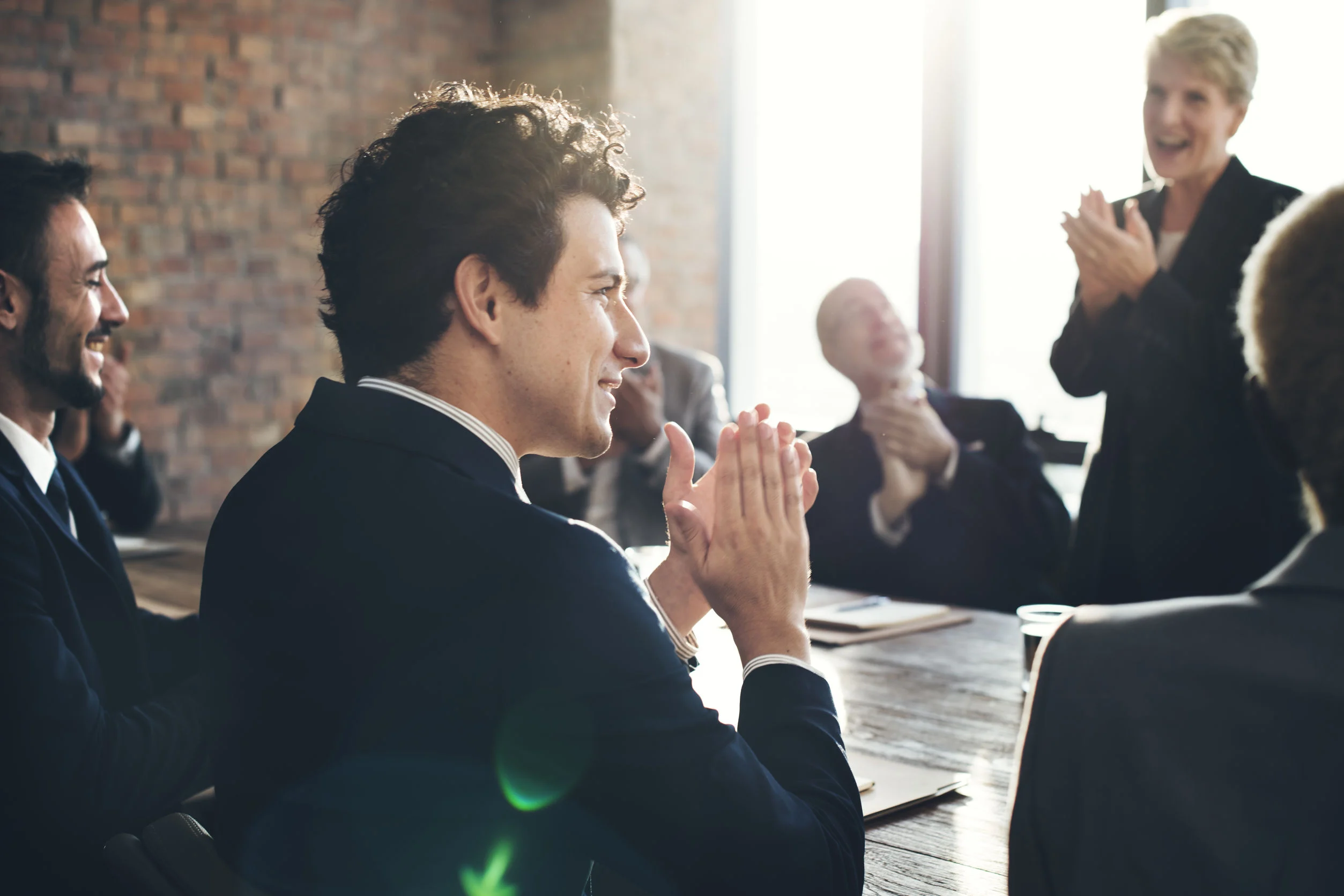 52448299 - corporate business team achievement success concept Man clapping