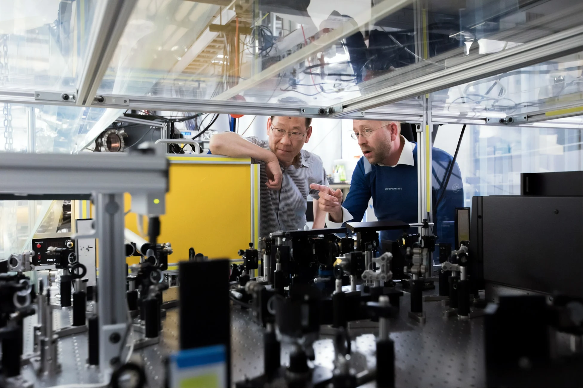 Workers inspecting industrial machinery