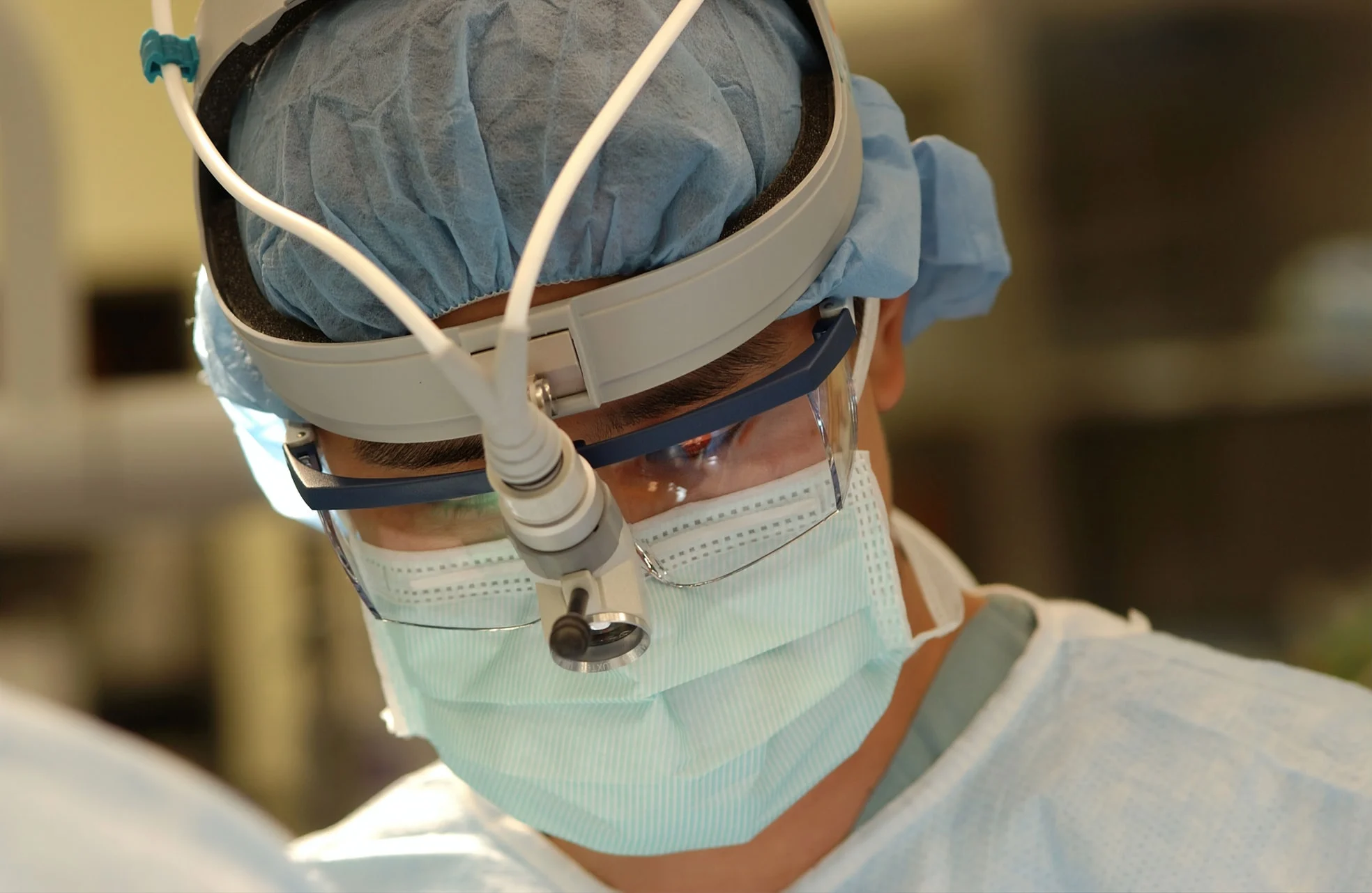 Surgeon wearing protective equipment