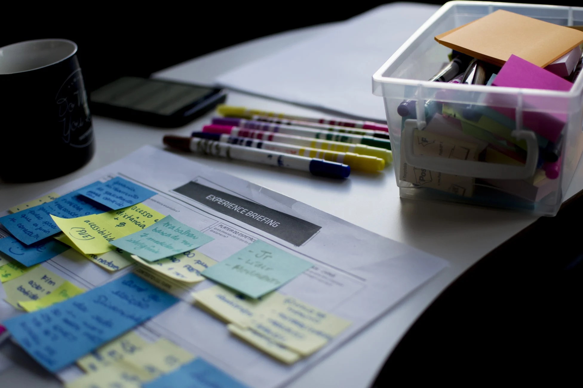 Incito-ValueStreamMapping-Blog-Feature-Dec2020 Value stream mapping materials and sticky notes on a worktable