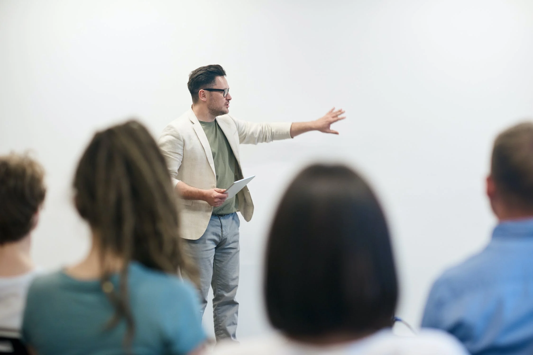 Instructor presenting Lean training to a seated group