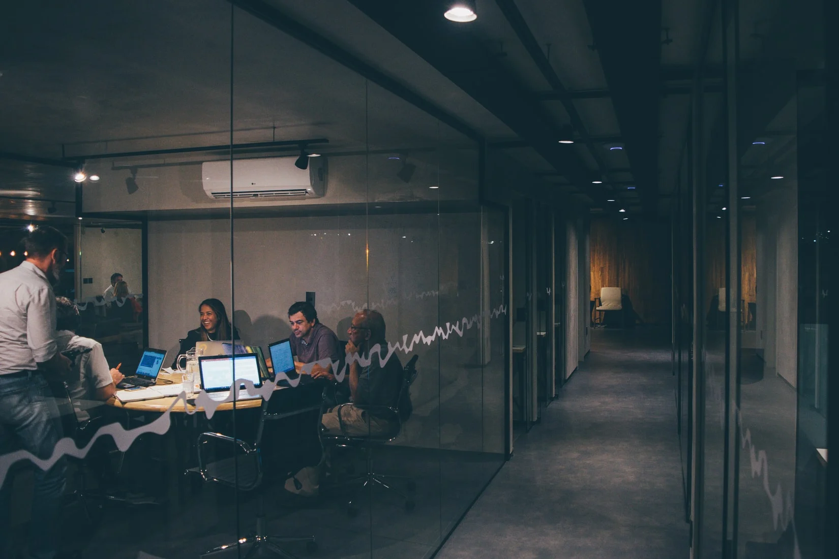Team meeting in a glass-walled conference room