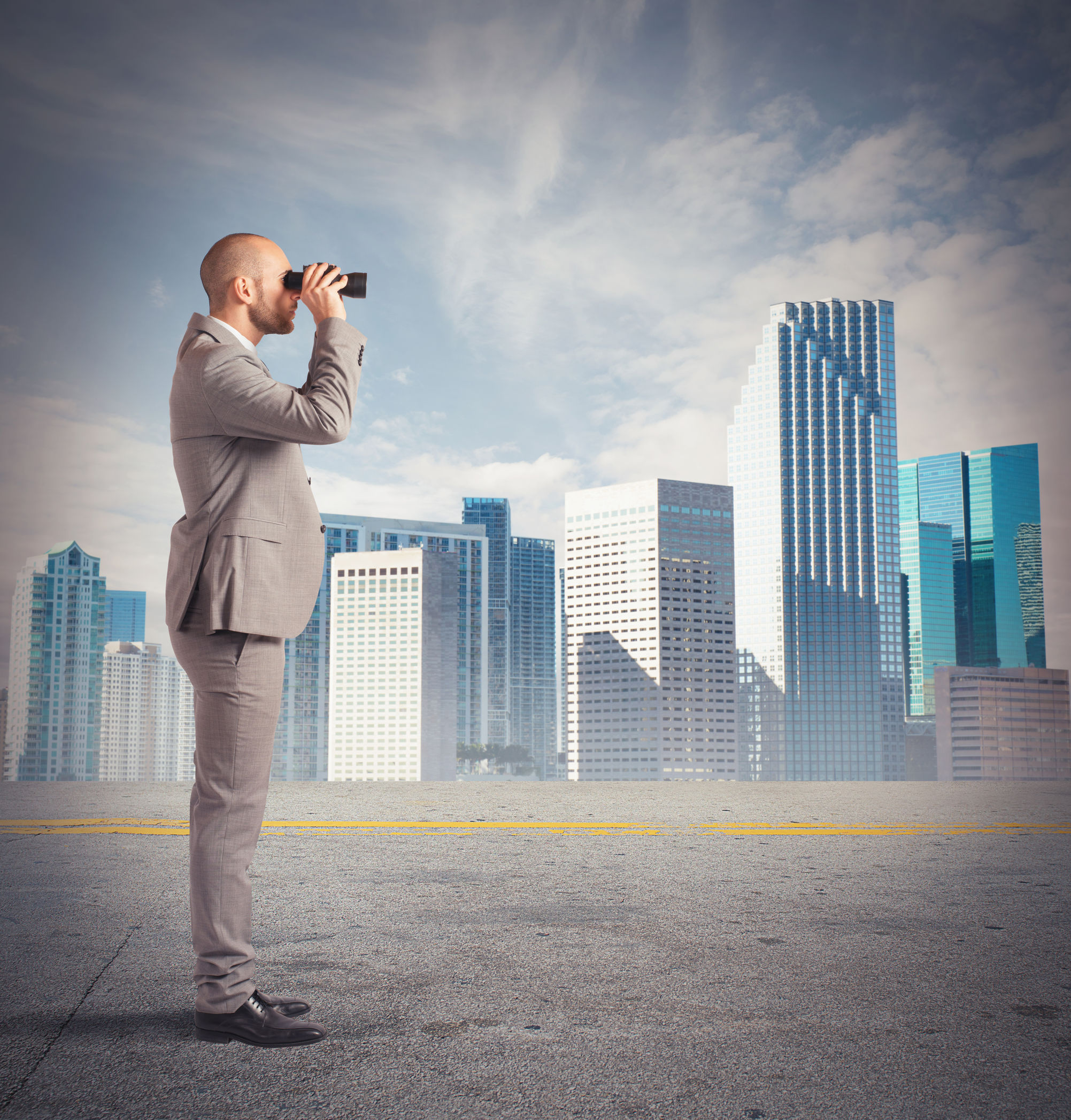 Man looking thorugh binoculars